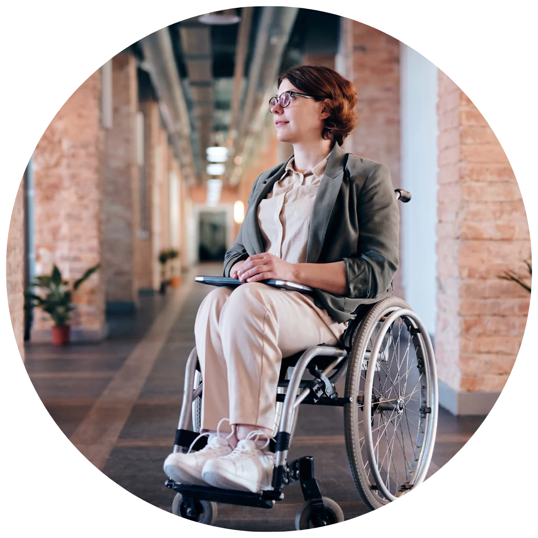 Disabled woman sitting in a wheel chair while smiling